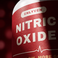 Extreme close-up of the Enlyven Nitric Oxide label with the heartbeat line, showing paper texture